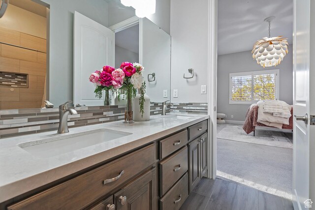 11274 S Eagle View Dr, Sandy, UT 84092 - full bath featuring double vanity, a sink, and decorative backsplash