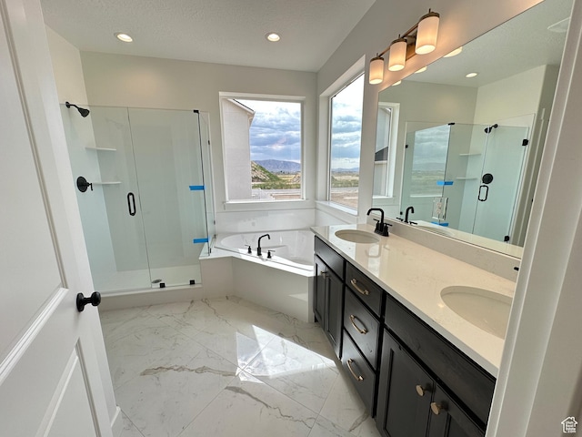 287 E 1150 N Unit 73, Salem, UT 84653 - bathroom featuring a shower stall, a garden tub, marble finish floors, double vanity, and recessed lighting