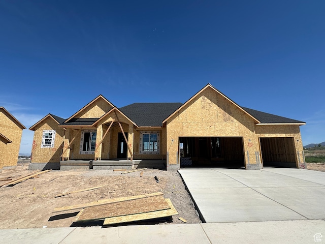 property in mid-construction featuring concrete driveway, a porch, and a garage