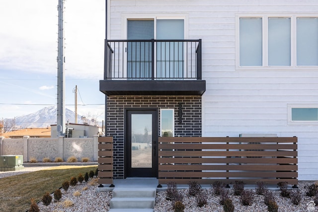 4475 S 500 E Unit 62, Millcreek, UT 84107 - entrance to property with a balcony, brick siding, and a mountain view