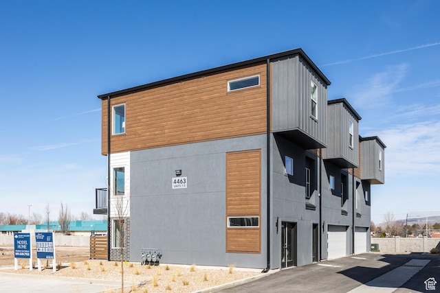 4475 S 500 E Unit 62, Millcreek, UT 84107 - view of building exterior with an attached garage and driveway