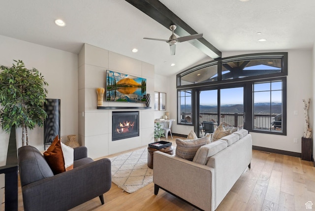 4186 Fairway Ln Unit G6, Park City, UT 84098 - living room with recessed lighting, lofted ceiling with beams, light wood-type flooring, a glass covered fireplace, and baseboards