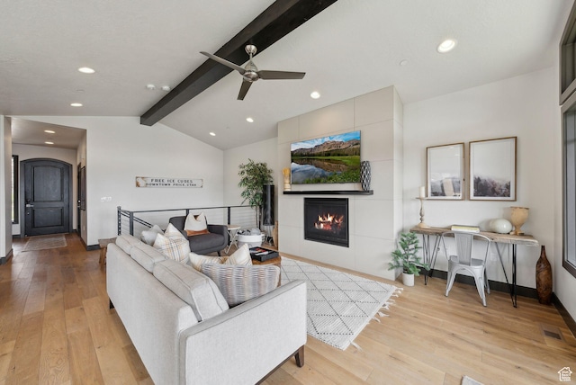 4186 Fairway Ln Unit G6, Park City, UT 84098 - living area featuring a tile fireplace, lofted ceiling with beams, recessed lighting, and light wood-style flooring