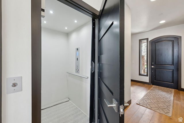 4186 Fairway Ln Unit G6, Park City, UT 84098 - foyer with elevator, light wood-type flooring, recessed lighting, and arched walkways