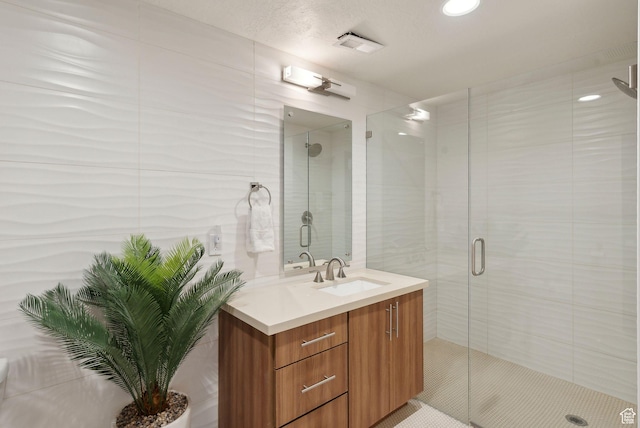 4186 Fairway Ln Unit G6, Park City, UT 84098 - bathroom with visible vents, a shower stall, and vanity