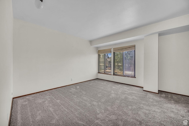 4169 S Village Ln Unit A, Taylorsville, UT 84129 - spare room featuring carpet flooring and baseboards