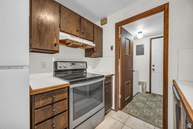 4169 S Village Ln Unit A, Taylorsville, UT 84129 - kitchen featuring under cabinet range hood, electric panel, light countertops, freestanding refrigerator, and electric range
