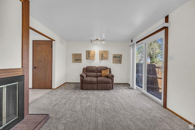 4169 S Village Ln Unit A, Taylorsville, UT 84129 - sitting room featuring baseboards, track lighting, and carpet