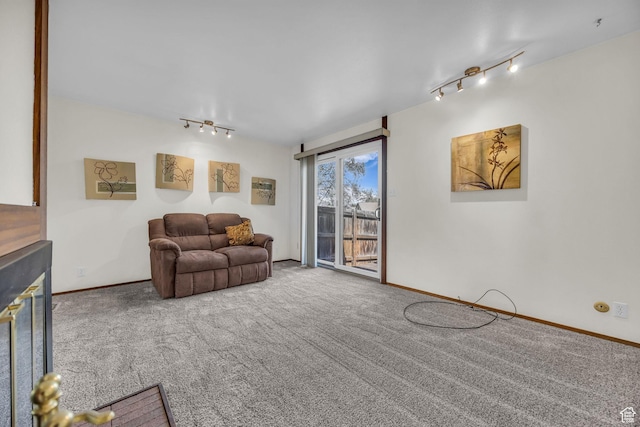 4169 S Village Ln Unit A, Taylorsville, UT 84129 - living area featuring track lighting, baseboards, and carpet floors