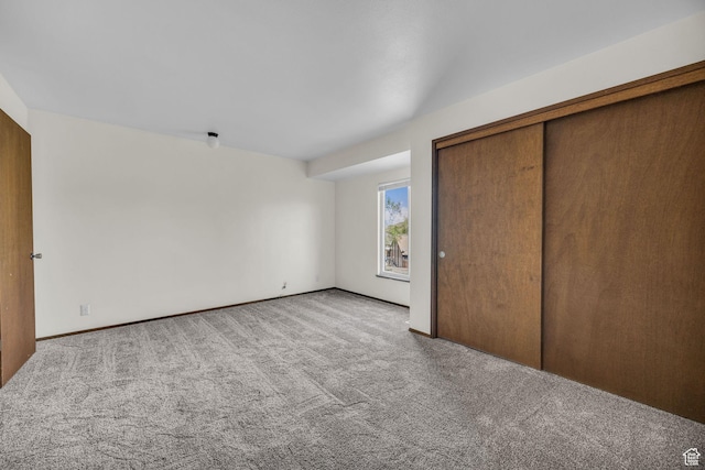 4169 S Village Ln Unit A, Taylorsville, UT 84129 - unfurnished bedroom with a closet and carpet