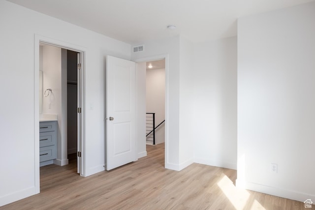 4479 S 500 E Unit 65, Millcreek, UT 84107 - unfurnished bedroom featuring visible vents, light wood-style flooring, and baseboards