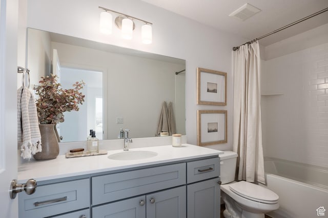 4479 S 500 E Unit 65, Millcreek, UT 84107 - bathroom with visible vents, shower / tub combo with curtain, toilet, and vanity