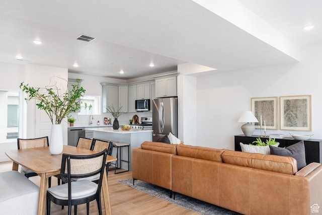 4479 S 500 E Unit 65, Millcreek, UT 84107 - living room with recessed lighting, visible vents, and light wood-style flooring