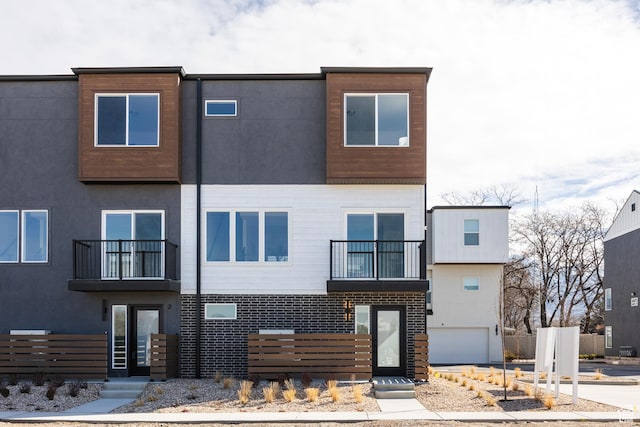 4479 S 500 E Unit 65, Millcreek, UT 84107 - view of front of property featuring stucco siding and a balcony