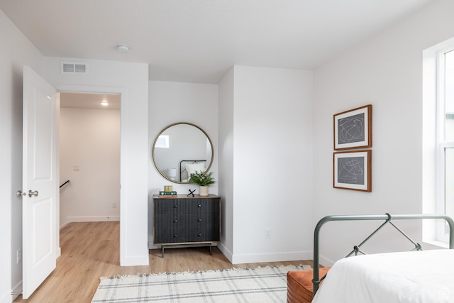 4479 S 500 E Unit 65, Millcreek, UT 84107 - bedroom featuring baseboards, visible vents, and light wood-style flooring