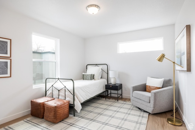 4479 S 500 E Unit 65, Millcreek, UT 84107 - bedroom featuring wood finished floors and baseboards