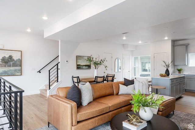 4479 S 500 E Unit 65, Millcreek, UT 84107 - living room with visible vents, baseboards, light wood-type flooring, recessed lighting, and stairs