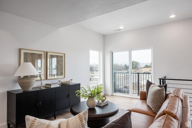 4479 S 500 E Unit 65, Millcreek, UT 84107 - living area featuring visible vents, recessed lighting, and wood finished floors