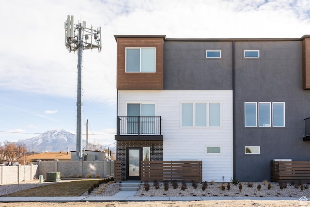 4479 S 500 E Unit 65, Millcreek, UT 84107 - contemporary home with a mountain view, fence, and a balcony