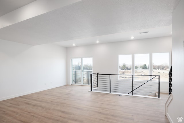 4479 S 500 E Unit 65, Millcreek, UT 84107 - empty room with wood finished floors, recessed lighting, visible vents, and baseboards