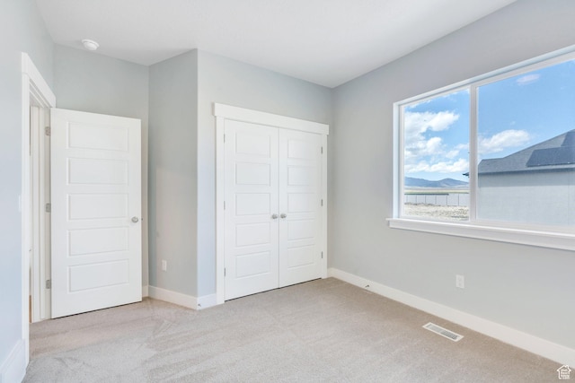 4867 N Canaan Peak Dr W, Eagle Mountain, UT 84005 - unfurnished bedroom with carpet flooring, a closet, and baseboards