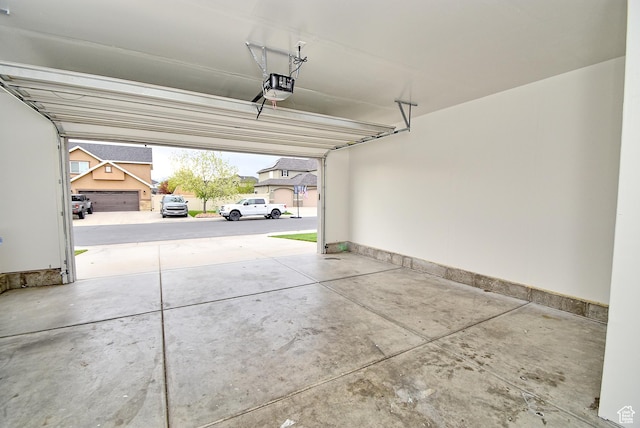 2041 S 750 E, Lehi, UT 84043 - garage featuring a garage door opener and baseboards
