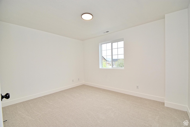 2041 S 750 E, Lehi, UT 84043 - spare room featuring visible vents, light carpet, and baseboards