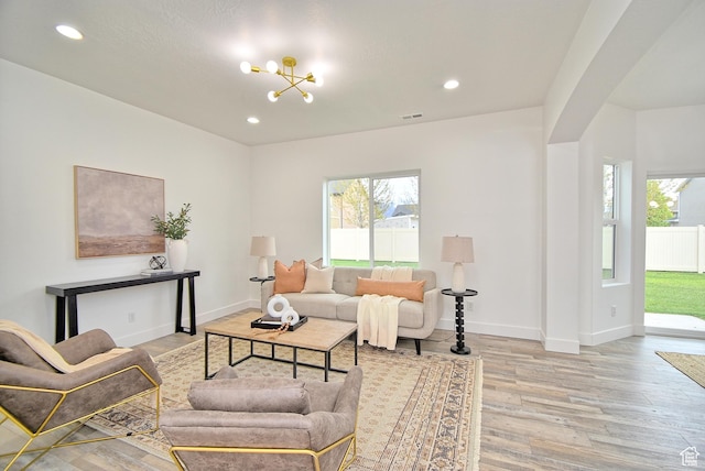 2041 S 750 E, Lehi, UT 84043 - living room featuring a wealth of natural light, a chandelier, light wood-type flooring, and visible vents