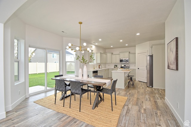 2041 S 750 E, Lehi, UT 84043 - dining area featuring baseboards, recessed lighting, an inviting chandelier, and light wood-style floors