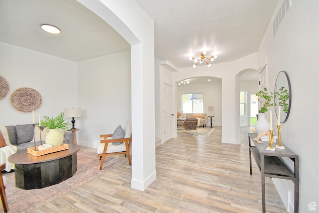 2041 S 750 E, Lehi, UT 84043 - entrance foyer with visible vents, baseboards, light wood-style flooring, and arched walkways