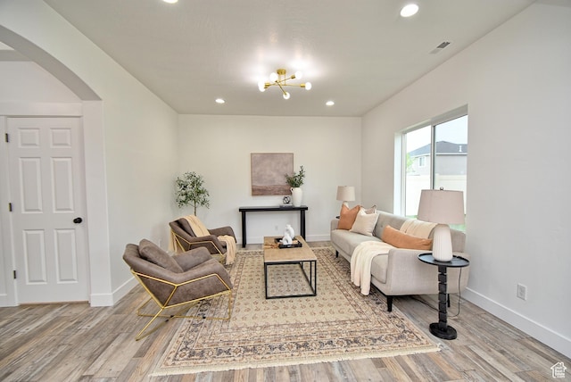 2041 S 750 E, Lehi, UT 84043 - living area featuring wood finished floors, baseboards, visible vents, and arched walkways