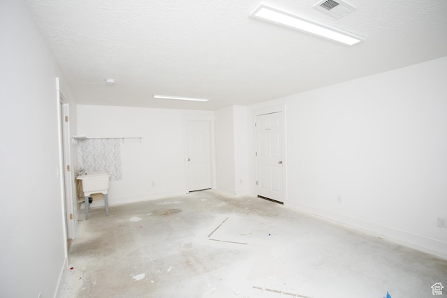 spare room with baseboards