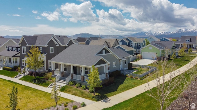 aerial view of residential area featuring a mountain backdrop