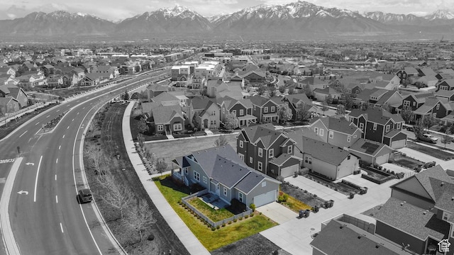 aerial view of residential area featuring a mountainous background and property parcel outlined
