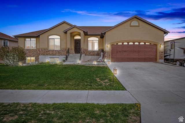 680 N 980 W, Tremonton, UT 84337 - single story home featuring stucco siding, a garage, concrete driveway, and stone siding