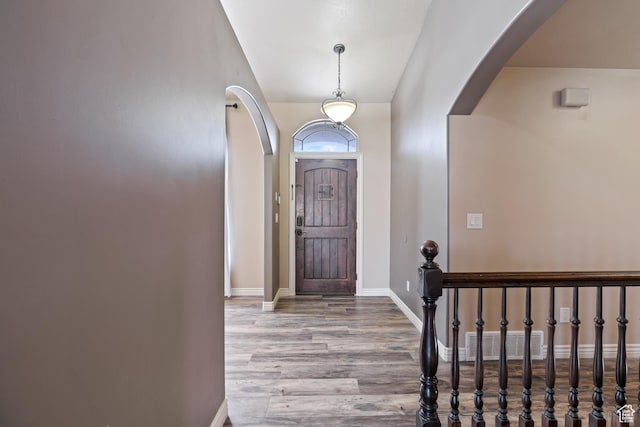 680 N 980 W, Tremonton, UT 84337 - entrance foyer with arched walkways, visible vents, wood finished floors, and baseboards
