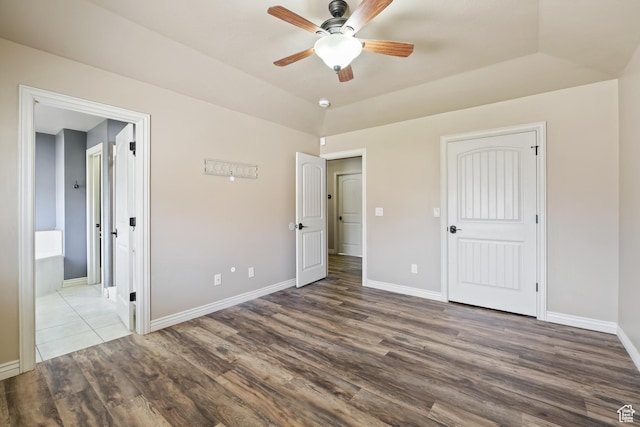 680 N 980 W, Tremonton, UT 84337 - unfurnished bedroom with wood finished floors, ensuite bathroom, a ceiling fan, and baseboards