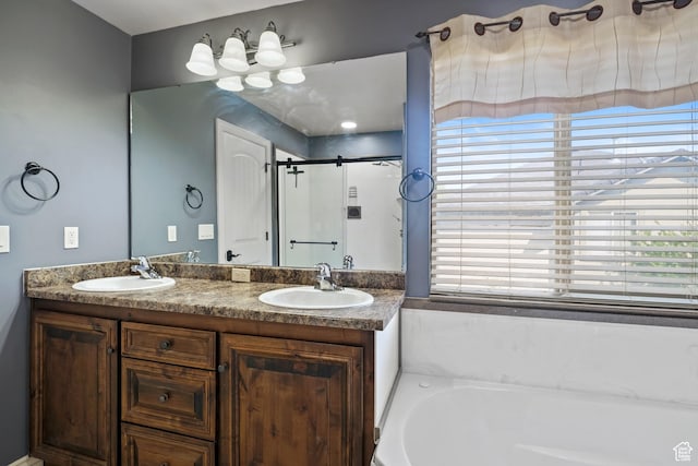 680 N 980 W, Tremonton, UT 84337 - full bathroom featuring double vanity, a bath, a stall shower, and a sink