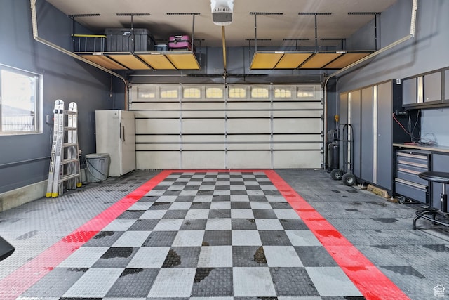 680 N 980 W, Tremonton, UT 84337 - garage with freestanding refrigerator and a garage door opener