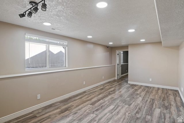680 N 980 W, Tremonton, UT 84337 - below grade area featuring a textured ceiling, wood finished floors, recessed lighting, and baseboards