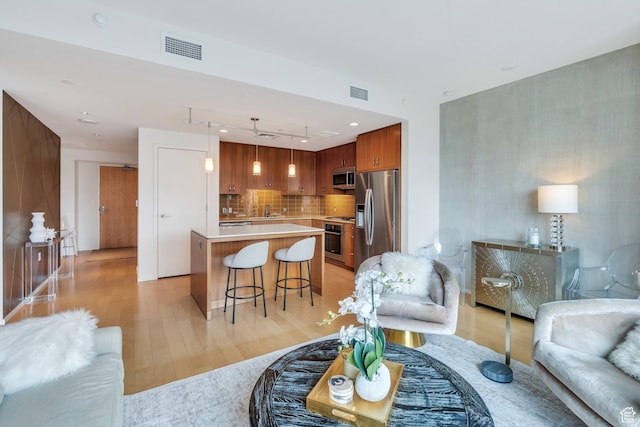 35 E 100 S Unit 1504, Salt Lake City, UT 84111 - living area featuring visible vents and light wood-style floors