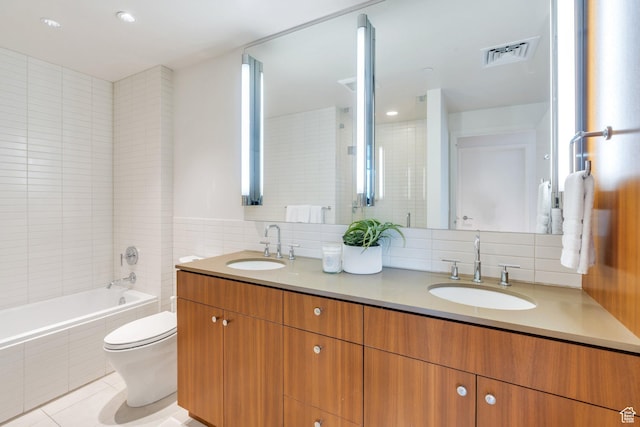 35 E 100 S Unit 1504, Salt Lake City, UT 84111 - bathroom with tile walls, visible vents, a tile shower, and a sink