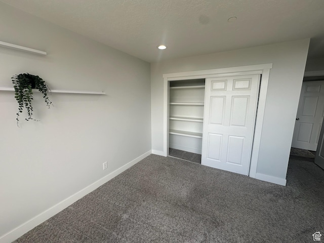 560 E S Temple St S Unit 302, Salt Lake City, UT 84102 - unfurnished bedroom with baseboards, recessed lighting, carpet floors, and a closet