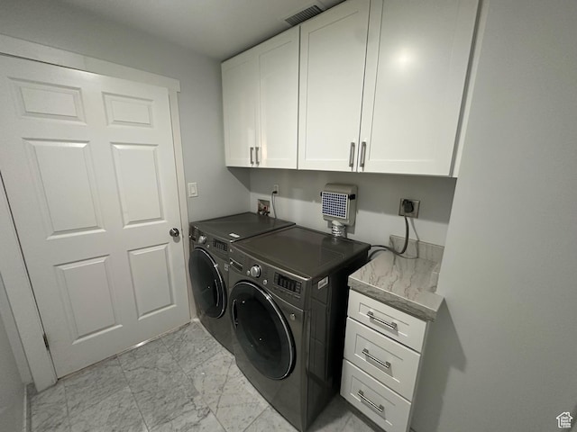 560 E S Temple St S Unit 302, Salt Lake City, UT 84102 - clothes washing area featuring marble finish floor, cabinet space, separate washer and dryer, and visible vents