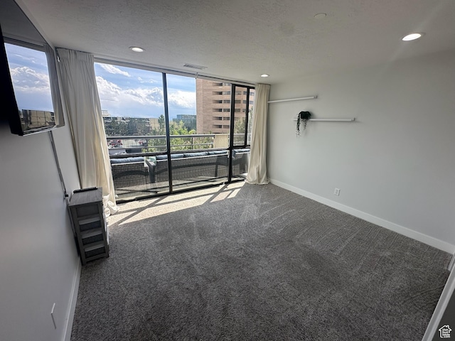 560 E S Temple St S Unit 302, Salt Lake City, UT 84102 - carpeted spare room featuring a textured ceiling, visible vents, recessed lighting, and baseboards