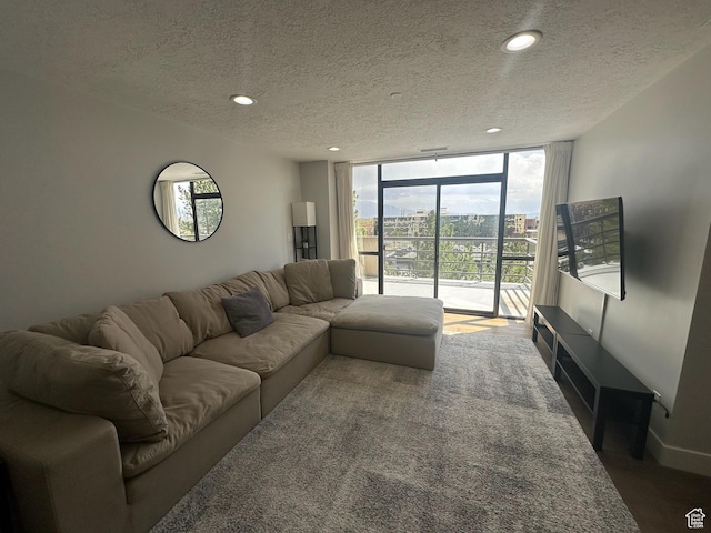 560 E S Temple St S Unit 302, Salt Lake City, UT 84102 - living room featuring recessed lighting, a textured ceiling, floor to ceiling windows, and carpet