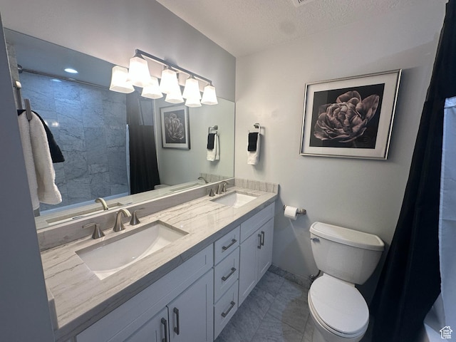 560 E S Temple St S Unit 302, Salt Lake City, UT 84102 - full bathroom with toilet, a textured ceiling, a sink, and marble finish floor