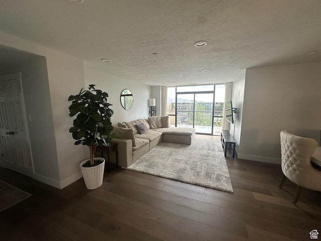 560 E S Temple St S Unit 302, Salt Lake City, UT 84102 - living area with a textured ceiling, expansive windows, dark wood-style floors, and baseboards