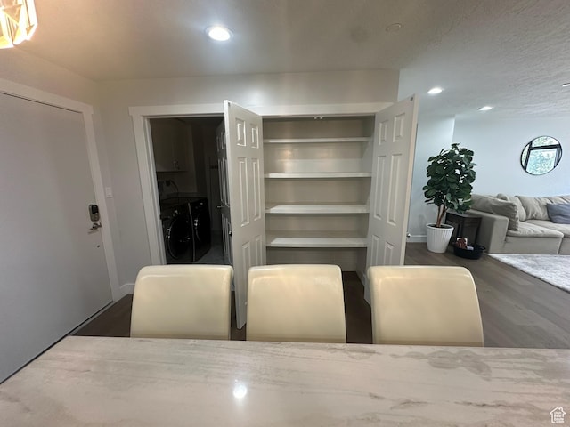 560 E S Temple St S Unit 302, Salt Lake City, UT 84102 - dining area with washing machine and dryer, recessed lighting, and wood finished floors