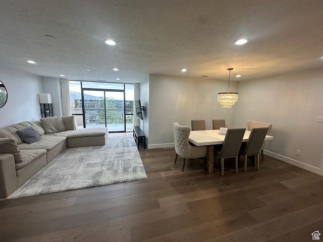 560 E S Temple St S Unit 302, Salt Lake City, UT 84102 - living area with dark wood-style flooring, recessed lighting, and baseboards